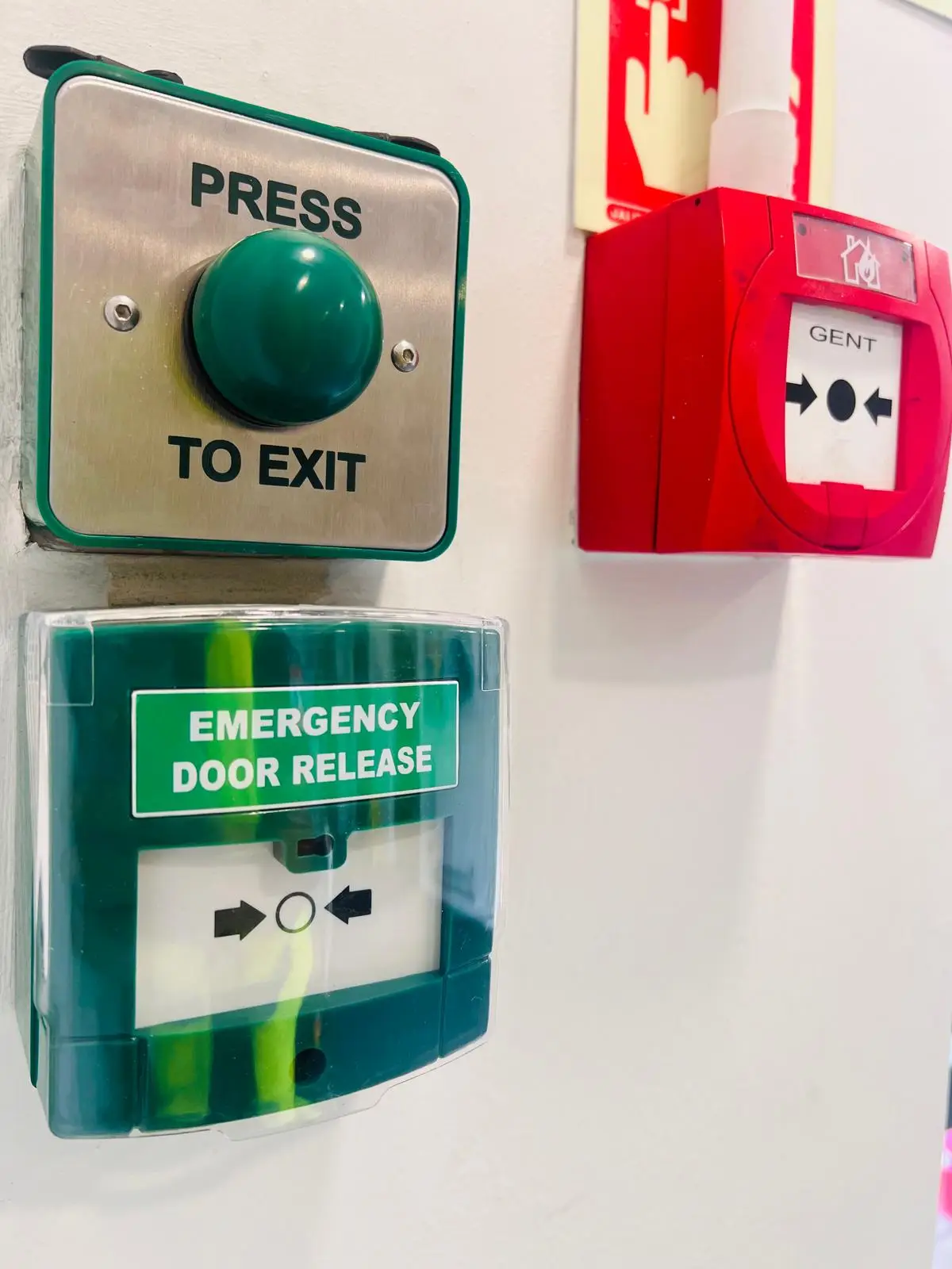 Engineer carrying out access control system maintenance on a secure door