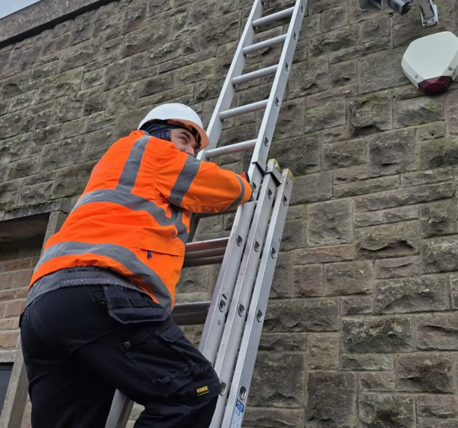 Engineer performing CCTV system maintenance and diagnostics