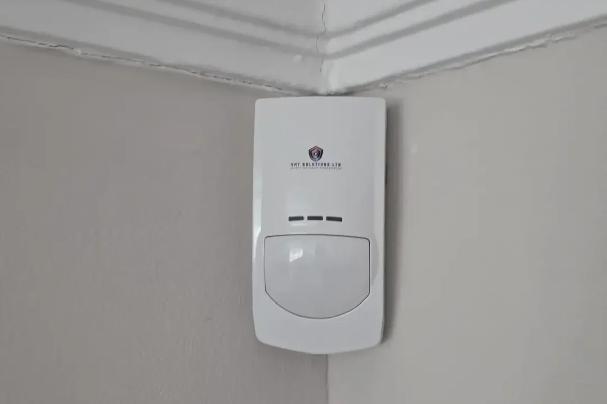 PIR motion detector installed as part of a professional intruder alarm system